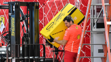 A Ferrari team member sets up for the grand prix.