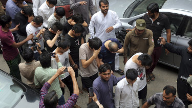 Detained Chinese nationals allegedly involved in a trafficking gang are taken to court in Lahore.