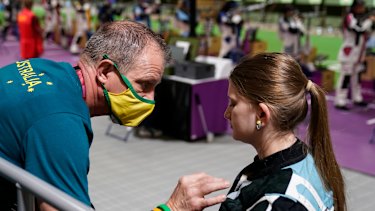 Katarina Kowplos takes time out to speak with her coach.