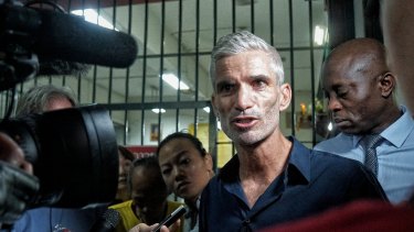 Craig Foster, left, and Francis Awartefe address the media outside the Thai court where Hakeem al-Araibi faces his extradition trial.