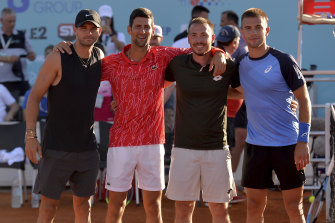 Novak Djokovic, second from left, poses with Bulgaria's Grigor Dimitrov (left), Serbia's Viktor Troicki and Croatia's Borna Coric in Croatia. All have tested positive to COVID-19.
