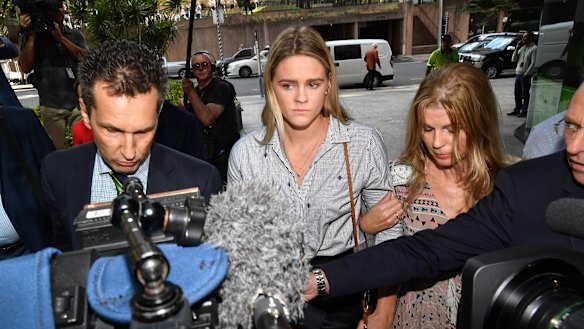 Australian swimmer Shayna Jack (centre) arriving for a briefing with ASADA in Brisbane.
