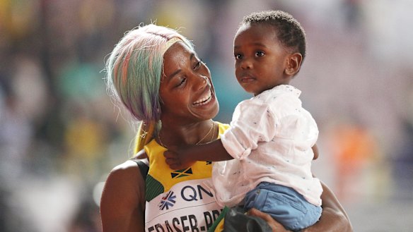 Shelly-Ann Fraser-Pryce of Jamaica celebrates with her son Zyon.