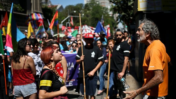 A man shouts anti-migrant slogans as a pro-migrant protester argues with him  in Santiago, Chile, last month.