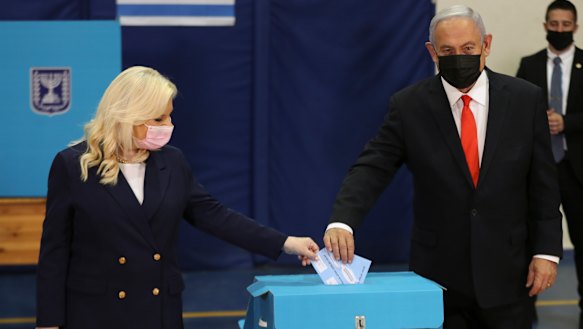Israeli Prime Minister Benjamin Netanyahu and his wife Sara cast their ballots at a polling station in Jerusalem.