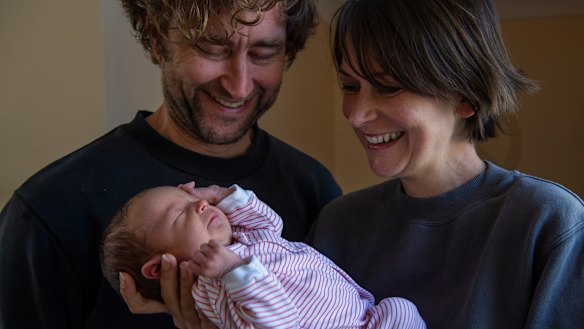 Bec Secomb with husband Josh holding their newborn daughter Lulu at the Bilgola Heights home.