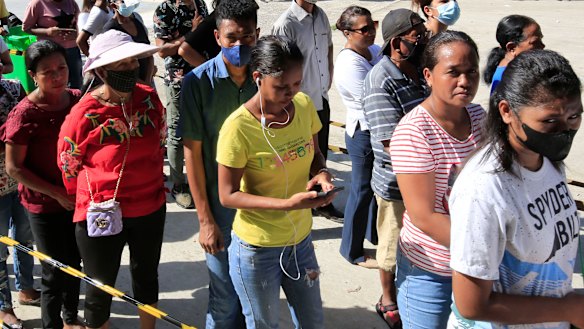 Voters line up to cast their ballots in Dili on Tuesday.