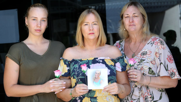 The aunts of Breeana  Robinson, Janine Mackney (centre) and Sharon Rowe (right) and her cousin Edyn Mackney pose with her photograph outside Southport Magistrates on the Gold Coast.