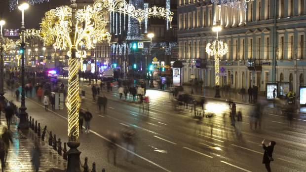 People walk in an empty Nevsky Prospect, during a New Year celebration in central St Petersburg, Russia.