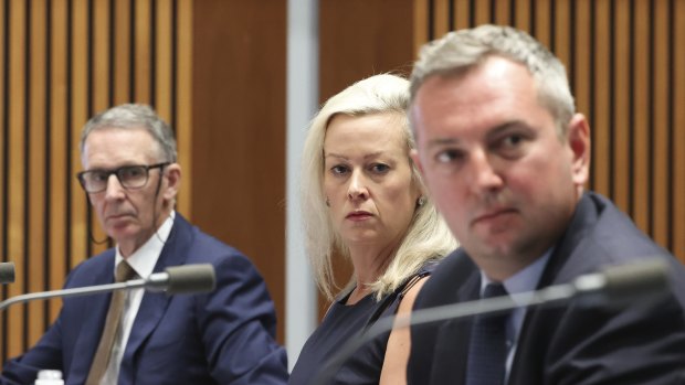 Side by side, they gunned together: News Corp’s Campbell Reid (left), AAP’s  Emma Cowdroy and Nine’s Chris Janz during Friday’s Senate hearing.