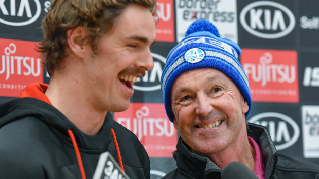 Joe and Neale Daniher share a laugh on Wednesday.