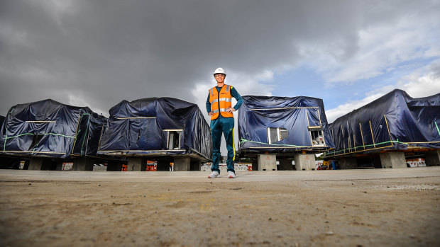 Australian cricket captain Meg Lanning and a disassembled tunnel boring machine in North Melbourne.