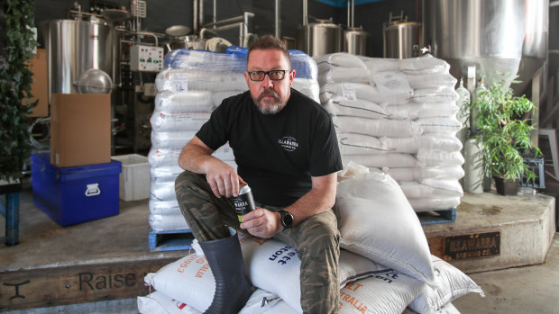 David McGrath from Illawarra Brewing Company with some bags of grain which will be sent to farmers after they are cooked.