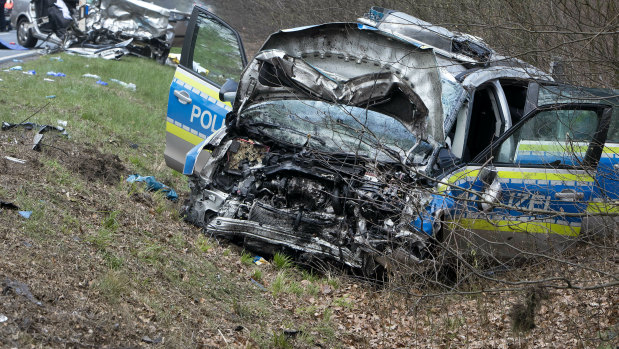 The police car with two police officers was on the way to a nearby plane crash as it collided with another car, background, carrying two young people who died in the crash. 