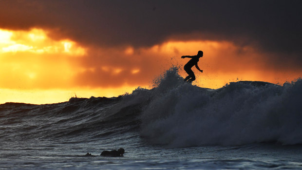 A surfer tackles the big waves at Bells Beach.