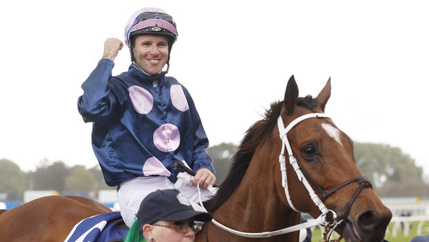 Tommy Berry celebrates on No Compromise after winning The Metropolitan.