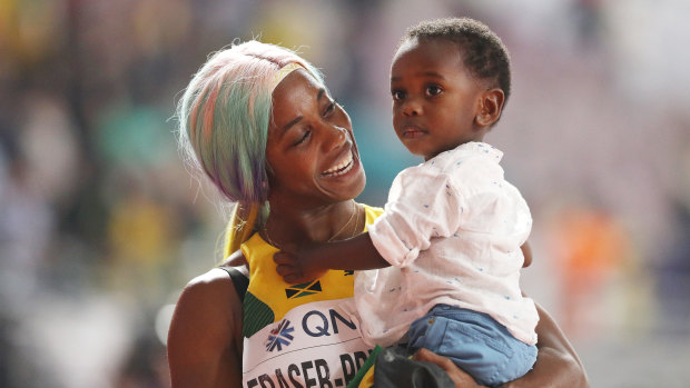 Shelly-Ann Fraser-Pryce of Jamaica celebrates with her son Zyon.