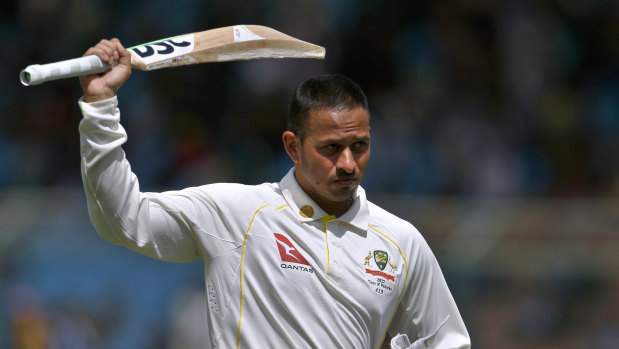 Usman Khawaja celebrates his century in Karachi.