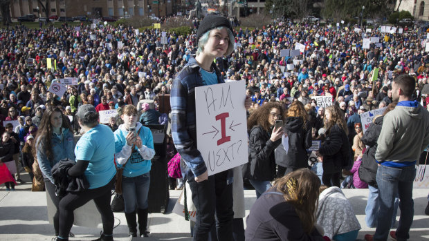 Rae Schalk holds a sign during "March for Our Lives" at the Idaho State Capitol in Boise on March 24.