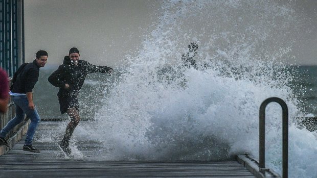 Wind whipping up waves at Frankston Pier on Tuesday. 