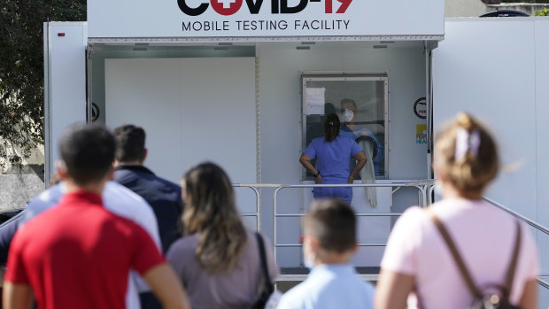 People lined up to receive a COVID-19 test in Opa-Locka, Florida.