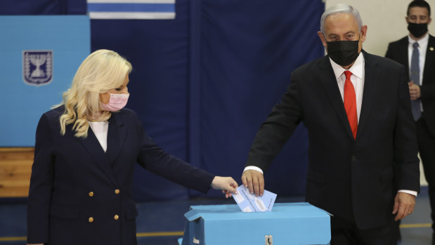Israeli Prime Minister Benjamin Netanyahu and his wife Sara cast their ballots at a polling station in Jerusalem.