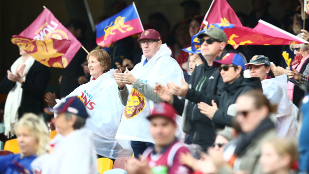 Brisbane fans cheer after the Lions win against the Adelaide Crows at the Gabba on June 28.