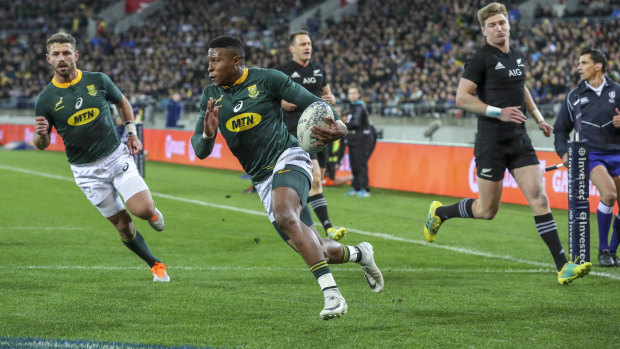 Upset: Aphiwe Dyantyi runs in to score one of his two tries against New Zealand in Wellington.