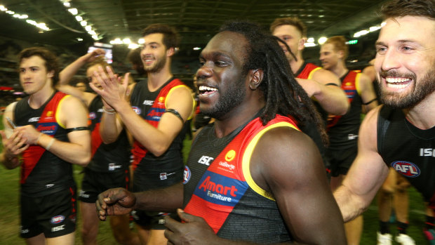 Bomber hero: Essendon’s Anthony McDonald-Tipungwuti is the centre of attention after his late goal sealed victory over North Melbourne.