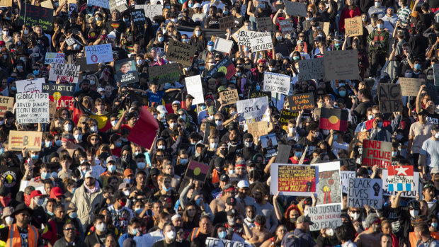 Protesters at Saturday's Black Lives Matter rally in Brisbane.