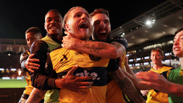 Jason Cummings and the Mariners celebrate a goal in the 2023 A-League Men’s decider at CommBank Stadium in Sydney.