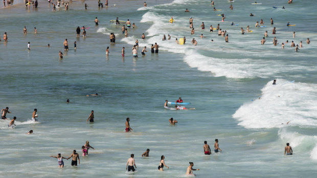 People cool off in the ocean at Bondi Beach on Boxing Day.