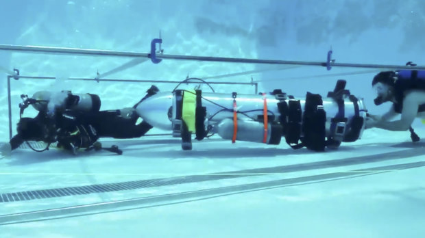 This frame grab from video tweeted by Elon Musk shows a "tiny kid-sized submarine" being tested in a pool.