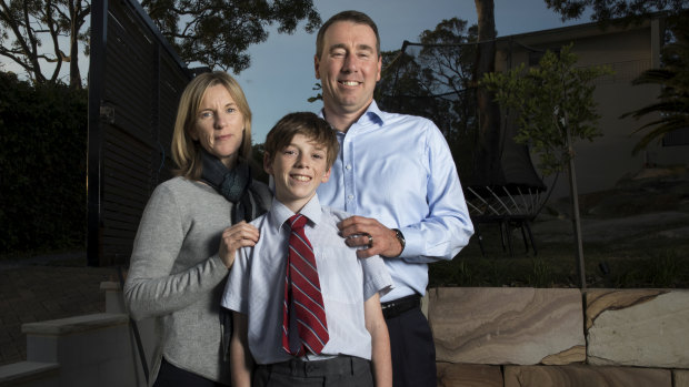 Adrian and Sue Fisk with son Aidan in their Sydney backyard. 