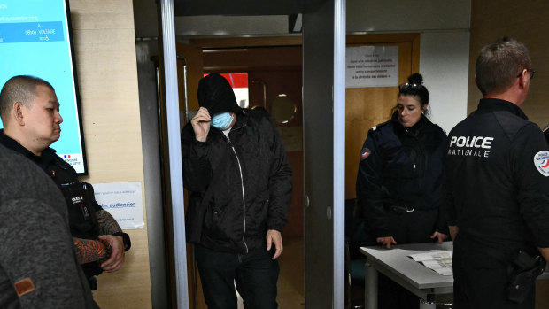 Dominique Pelicot’s co-accused pass security on arrival at the court in Avignon.