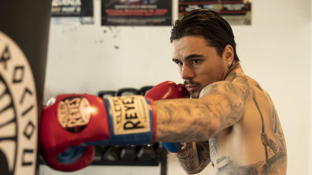Sydney boxer George Kambosos jnr works the bag at his Sylvania gym. He's earned a shot at the undisputed lightweight crown and it could happen in Australia.