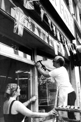Worse to come … Terry and Maria Horsenell follow police warnings and cover their fish and chip shop window with netting where only last week they had put out bunting for the royal wedding.