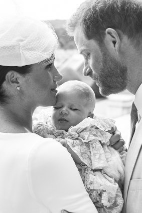 Meghan and Harry with baby Archie in a christening photo released on social media.