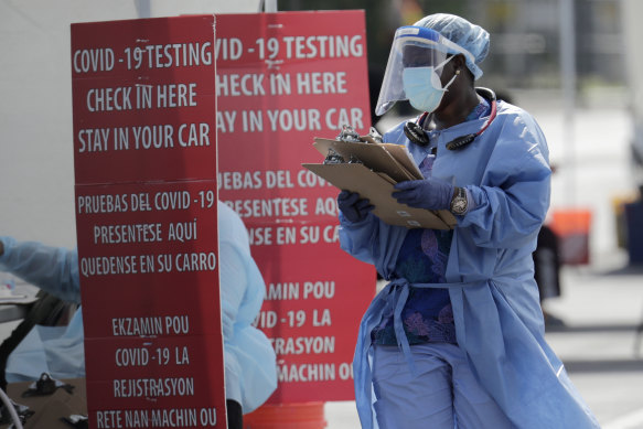 A healthcare worker at a COVID-19 testing site in South Florida, the centre of one of the latest outbreaks in the US.