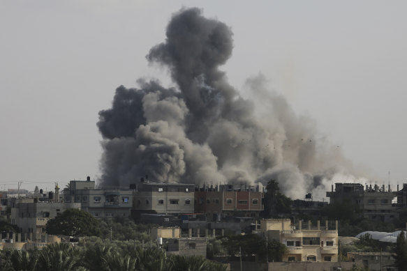Smoke rises from an explosion caused by Israeli airstrikes on the border between Egypt and Rafah.