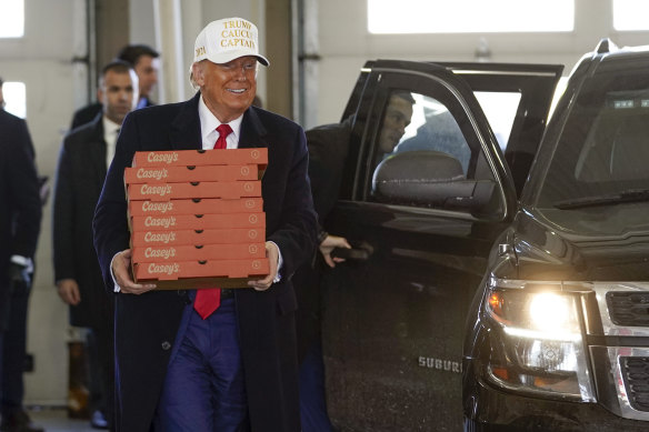 Republican presidential candidate Donald Trump delivers pizzas to firefighters at Waukee Fire Department in Iowa.