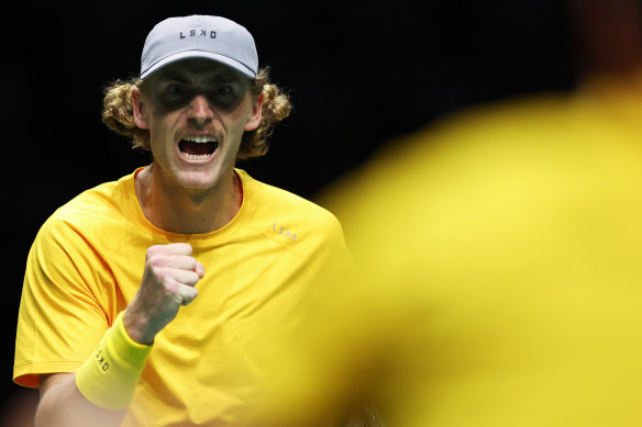 Max Purcell celebrates after winning a set with doubles partner Matt Ebden.