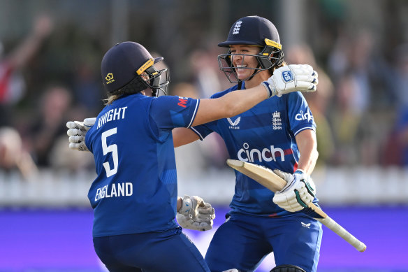 England captain Heather Knight celebrates the crucial victory with Kate Cross.