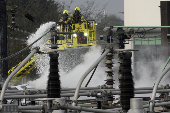Firefighters extinguish the fire at the North Hyde electrical substation.