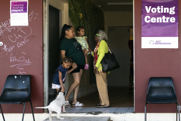 Takani Warner with her daughters at the Cherbourg voting centre.