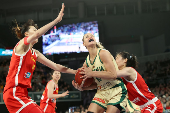 Alice Kunek of the Opals attempts to get a shot away.
