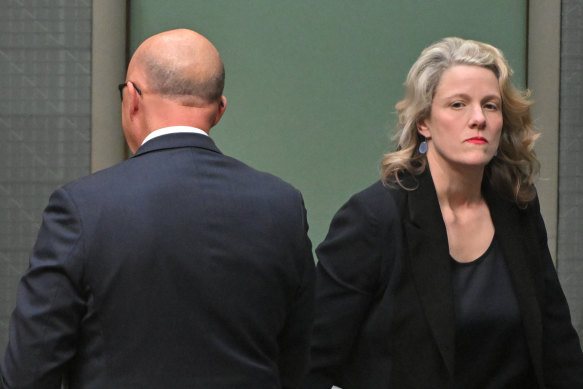 Peter Dutton and Clare O’Neil cross paths during a division in the House of Representatives.