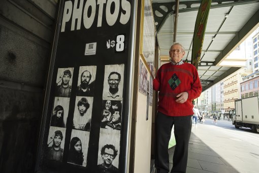 Alan Adler, 91, who operated the Flinders Street Station photo booth for 50 years. Younger photos of him are among images on the booth.