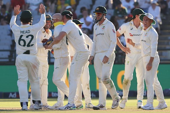 Australian players celebrate the wicket of South Africa’s captain Temba Bavuma.