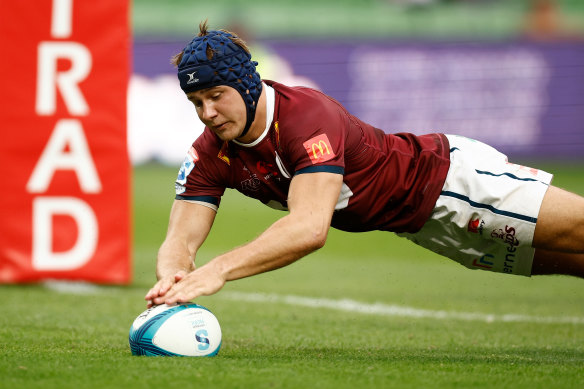 Josh Flook of the Reds scores a try during the round 2 contest.